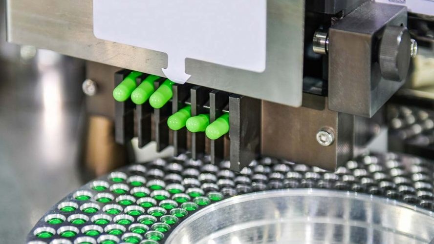 Automated processing equipment at a pharmaceutical manufacturing facility